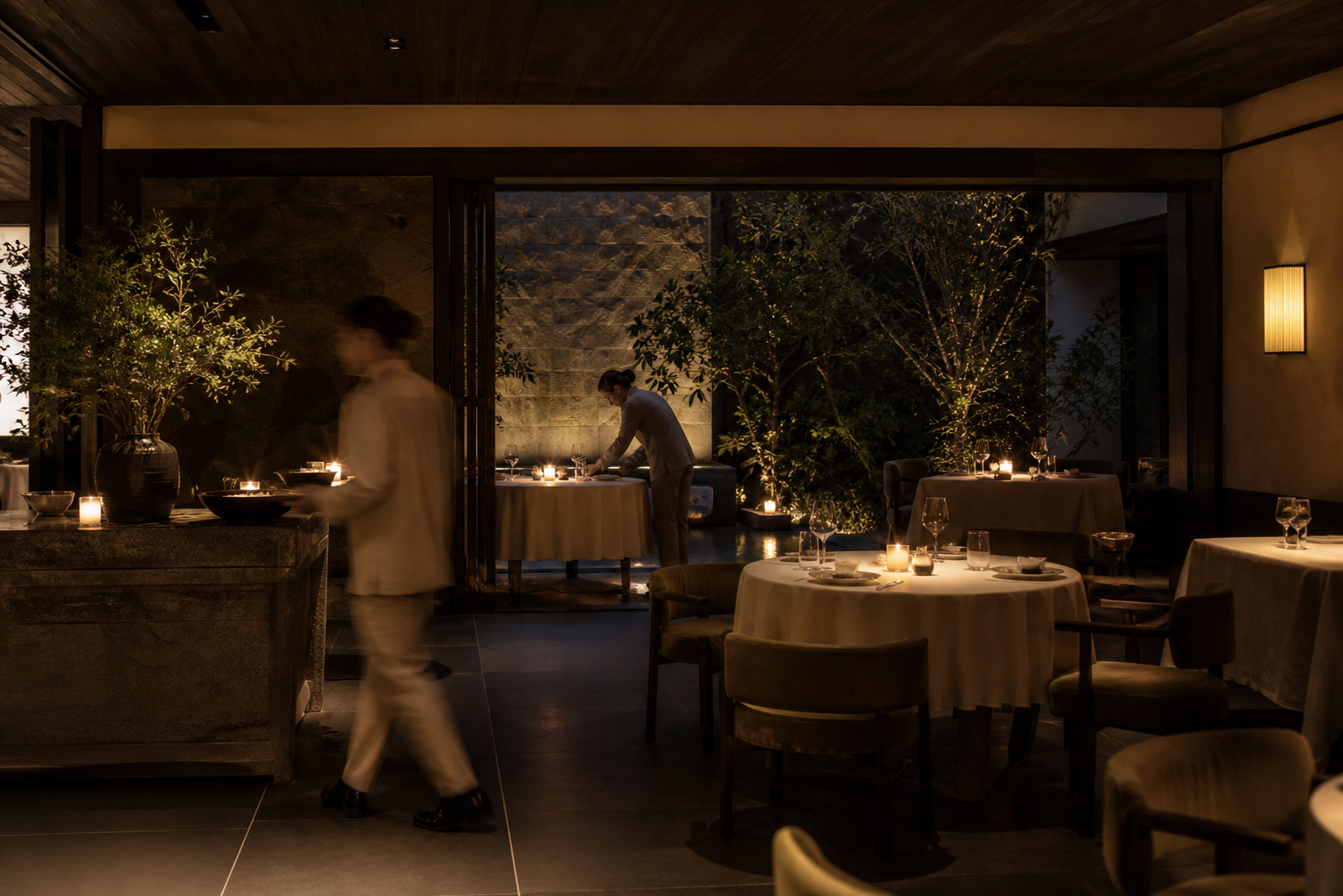 Hospitality team preparing a restaurant for evening service